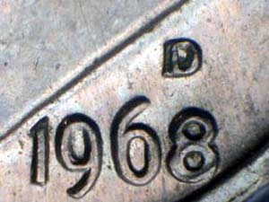 1968-D dime mint mark close-up showing D over S repunched mint mark error with S remnants visible beneath the D